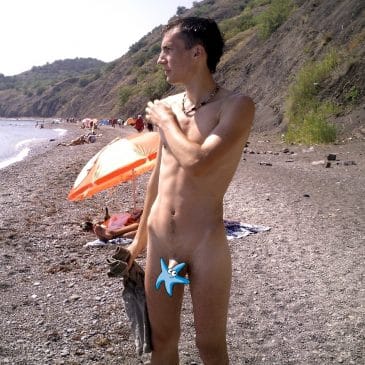 Nude boy on the beach
